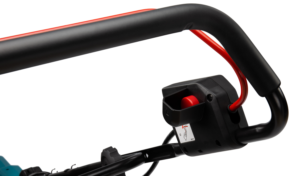 Detail van de bediening en veiligheidshendel van de Makita DLM382Z